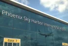 Airliner landing reflecting in the windows with phoenix sky harbor international airport text 3D rendering