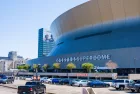 NEW ORLEANS^ LA^ USA - APRIL 3^ 2022: Superdome with parking lot and hint of the skyline during NCAA Men's Final Four Basketball Tournament