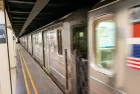 Fast moving train in New York subway. 18th street station.