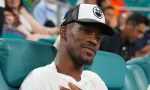 Jimmy Butler^ basketball player for the Miami Heat^ attends the semifinal match at 2023 Miami Open at the Hard Rock Stadium in Miami MIAMI GARDENS^ FLORIDA - MARCH 31^ 2023