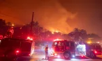 Firefighters battle the Eaton fire as its burns in Sierra Madre^ east side of Los Angeles^ California^ Wednesday^ Jan. 8^ 2025..