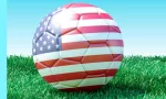 soccer balls in USA flag colors on green grass. Women's soccer. 3d image