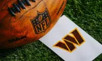 Washington Commanders NFL team Logo and American football ball on Green Grass.