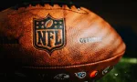 NFL Leather Ball and Emblem in Focus. National Football League official ball