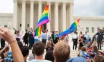 Crowd waving flags in support of LGBTQ community gathers at the U.S. Supreme Court ; WASHINGTON June 26^ 2015