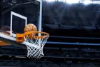 basketball going into hoop at arena (NBA)