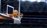basketball going into hoop at arena (NBA)