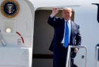 President Donald Trump waves as he steps off Air Force One at John Wayne Airport^ Santa Ana^ Calif.^ on Sunday Oct. 18^ 2020.