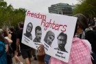 Demonstrators gather during a protest in front of the White House in Washington^ DC^ on April 19^ 2025.