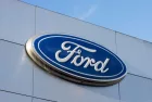 Closeup of the Ford logo seen at a Ford dealership store in Sunnyvale^ California. Ford Motor Company is an American multinational automobile manufacturer. Sunnyvale^ CA^ USA - Nov 22^ 2023