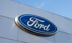 Closeup of the Ford logo seen at a Ford dealership store in Sunnyvale^ California. Ford Motor Company is an American multinational automobile manufacturer. Sunnyvale^ CA^ USA - Nov 22^ 2023