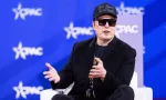 Elon Musk speaks with Newsmax Host Rob Schmitt on day 1 of the 2025 Conservative Political Action Conference. NATIONAL HARBOR^ MD^ USA — February 20 2025