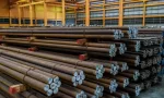 Rows of Steel Round Bar storage and stacking in the warehouse for industrial construction.