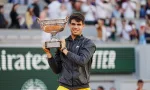 Roland Garros champion Carlos Alcaraz of Spain during trophy presentation after men's final match victory against Alexander Zverev of Germany in Paris^ France. PARIS^ FRANCE - JUNE 9^ 2024