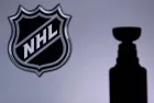 National Hockey LeagueLogo of NHL club on the screen. Stenley Cup Trophy Silhouette.
