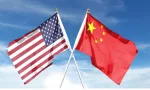 American and Chinese flags on cloudy sky. waving in the sky