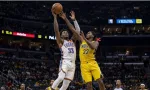 Realistic photography of two basketball players fighting in the air to catch the ball falling after a failed shot in an nba game. one basketball player is from the oklahoma city thunder and the other basketball player is from the indiana pacers. the photo