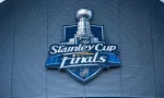 the front facade of a hockey arena with the NHL Stanley Cup Finals logo on the front of the building.