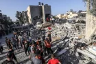 Palestinians evacuate wounded after an Israeli airstrike in Rafah refugee camp^ southern Gaza Strip^ on October 13 2023.
