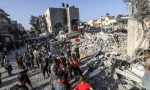 Palestinians evacuate wounded after an Israeli airstrike in Rafah refugee camp^ southern Gaza Strip^ on October 13 2023.