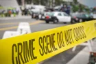 crime or accident scene sign do not pass the line with police cars in the background