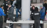 Security Checkpoint and control in Toronto^ Canada - March 24 2018: Scanning Machines^ People's Bags Getting Checked.