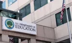 The exterior sign and US flag in front of the U.S. Department of Education offices in Washington^ DC. Washington^ DC USA; September 5^ 2024