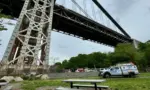 NYPD Police truck responding to a person who has climbed up the George Washington Bridge in Fort Washington Park New York^ NY USA - May 18^ 2024