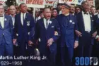 Martin Luther King during a protest march on postage stamp Milan^ Italy – January 7^ 2024