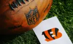 Cincinnati Bengals NFL team Logo and American football ball on Green Grass. CINCINNATI^ USA^ FEBRUARY 10^ 2025