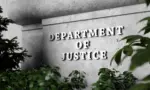 Silver sign of Department of Justice on a classical concrete wall with plants as foreground. 3D illustration of the concept of enforcement of federal laws