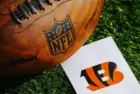 Cincinnati Bengals NFL team Logo and American football ball on Green Grass. CINCINNATI^ USA^ FEBRUARY 10^ 2025
