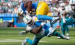 Los Angeles Chargers wide receiver Mike Williams (TOP) is brought down by Miami Dolphins cornerback Kader Kohou (BOTTOM) during an NFL football game^ Sept. 10^ 2023^ in Inglewood^ Calif.