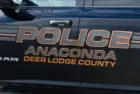 Sign on Anaconda Deer Lodge County police car in closeup. Anaconda^ MT^ USA - May 6^ 2025
