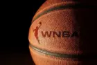 Closeup of a basketball with the WNBA logo and text Raleigh^ NC - USA - 06-13-2024