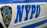 Side door closeup of Nypd police patrol car are patrolling parked near the curb. New York november 2020