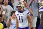 Washington's Jalen McMillan (11) celebrates with teammates after scoring a touchdown against the UCLA during an NCAA college football game Friday^ Sept. 30^ 2022^ in Pasadena^ Calif.