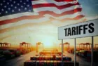 Selective focus on laptop screen displaying US high Tariffs on other countries Export and Import business and Tariff War in the world.