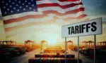 Selective focus on laptop screen displaying US high Tariffs on other countries Export and Import business and Tariff War in the world.