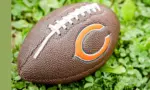 Football with Chicago Bears logo the on grass. Chicago Bears of the National Football Conference North. Rockford^ WI / USA.- Feb 12^ 2019