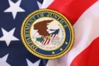 US Department of Justice seal on United States of America flag close up