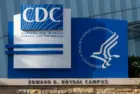 Closeup of the CDC logo seen at the Edward R. Roybal campus^ the headquarters of the Centers for Disease Control and Prevention (CDC) in Atlanta^ Georgia.