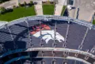 Aerial Top-Down View of Denver Broncos Logo in Empty Stadium Seats at Empower Field May 26^ 2022 Denver^ Colorado
