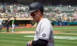 New York Yankees' Anthony Rizzo #48 walks back to the dugout after grounding out during a game against the Oakland Athletics at RingCentral Coliseum. Oakland^ California - August 28^ 2021