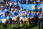 UCLA players run onto the field before an NCAA college football game between the UCLA and the Arizona State^ Nov. 11^ 2023^ in Pasadena^ Calif.