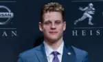 Quarterback Joe Burrow of the LSU Tigers winner of the 85th annual Heisman Memorial Trophy poses with trophy at the Marriott Marquis Hotel New York^ NY - December 14^ 2019