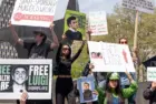Activists gathered in front of Federal Court where Luigi Mangione was arraigned on Federal Charges accusing him of killing United HealthCare CEO Brian Thompson New York - April 25^ 2025