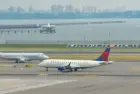 : Delta Airlines and American Eagle planes seen at the runway of LaGuardia International Airport. Manhattan^ New York^ USA - August 5^ 2025