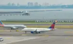 : Delta Airlines and American Eagle planes seen at the runway of LaGuardia International Airport. Manhattan^ New York^ USA - August 5^ 2025
