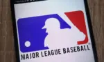 Major League Baseball logo displayed on a modern smartphone KONSKIE^ POLAND - SEPTEMBER 07^ 2018